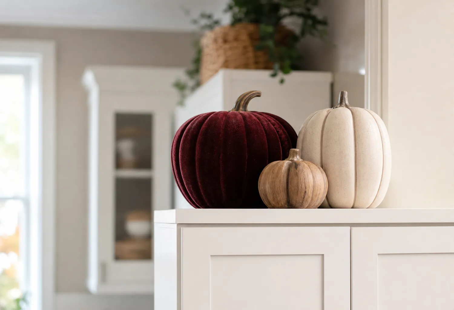 Layered Pumpkins on Top of Cabinets